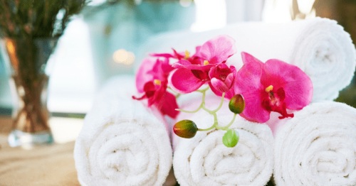 Aromatherapy massage with candles and essential oils